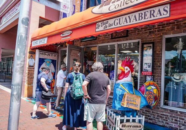 Visitors outside La Casa de las Guayaberas on Calle Ocho, Little Havana, Miami.