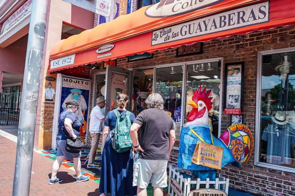 Visitors outside La Casa de las Guayaberas on Calle Ocho, Little Havana, Miami.