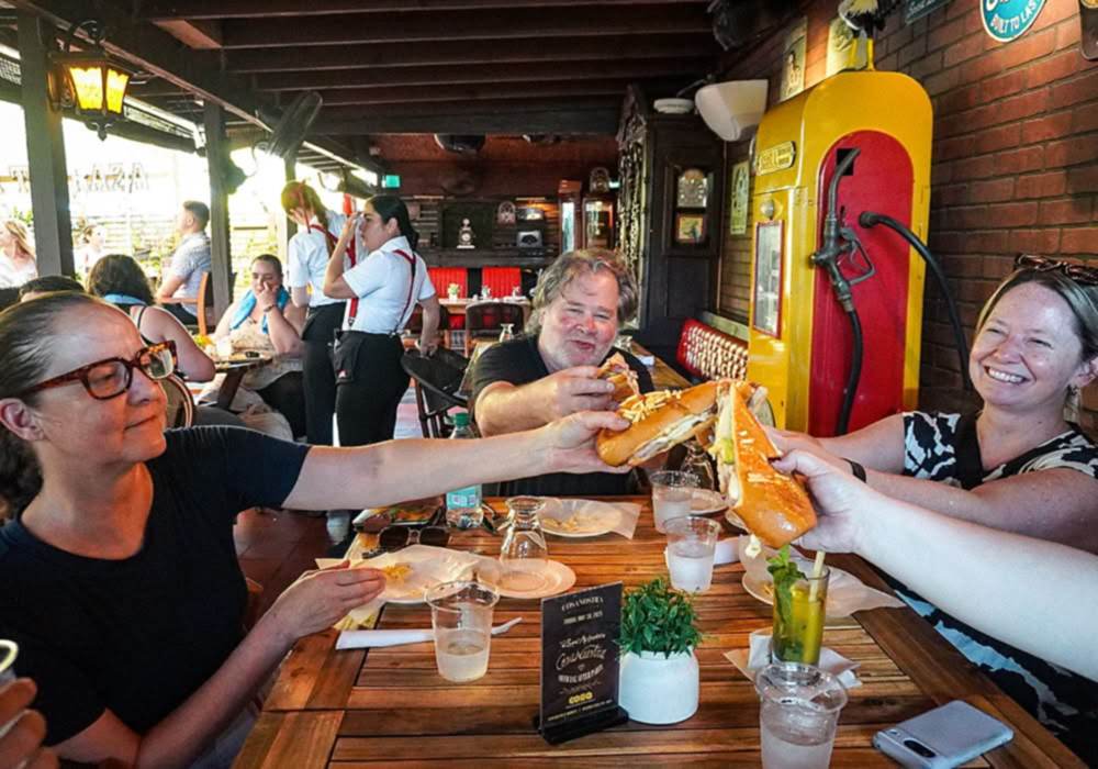 Guide and guests on a Little Havana food tour, Calle Ocho, Miami.